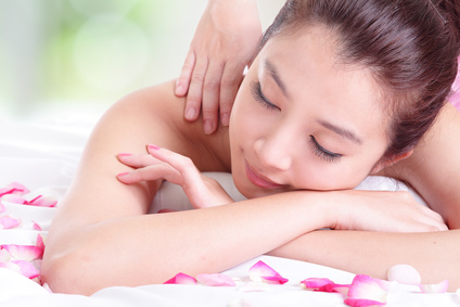 girl with attractive face having a massage for shoulder